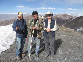 Maryann with Phuntog (guide) and another climber. The snow to our left is hip-deep. We are above Stok Kangri base camp. From here we had a view of some of the remainder of the route and Phuntog said he had never seen so much snow on the mountain. Maryann with Phuntog (guide) and another climber. The snow to our left is hip-deep. We are above Stok Kangri base camp. From here we had a view of some of the remainder of the route and Phuntog said he had never seen so much snow on the mountain.